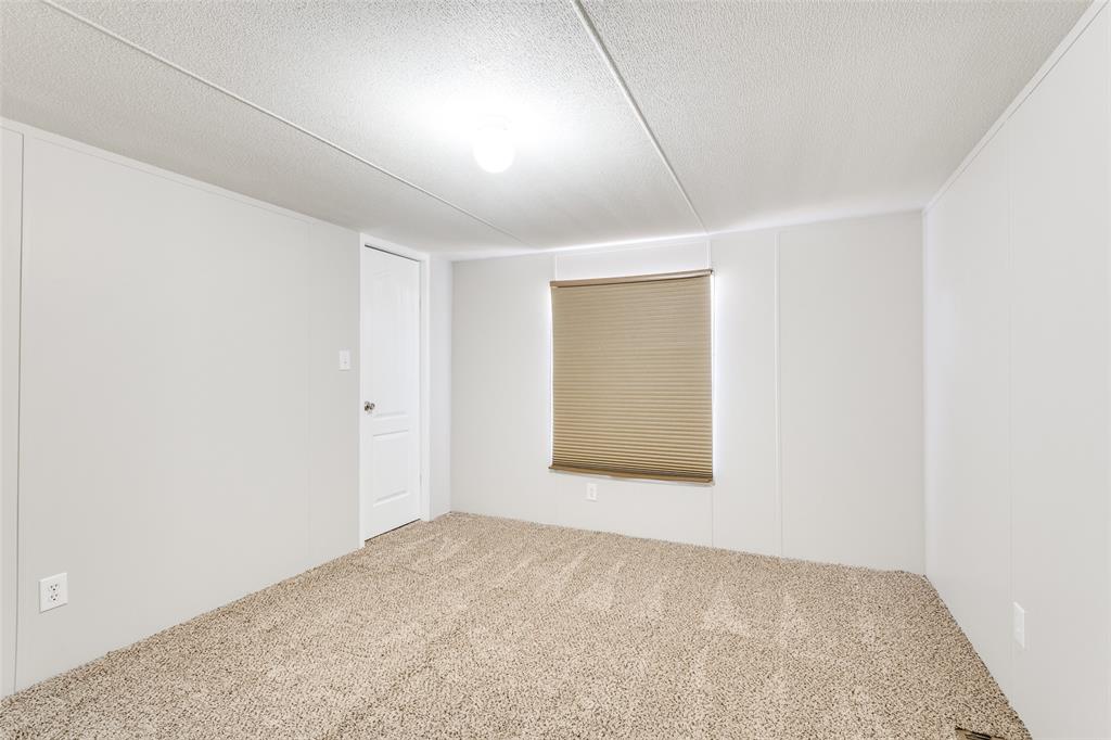 445 Arvel Circle Azle, TX 76020 - Photo 13 of 25 an empty room with a window