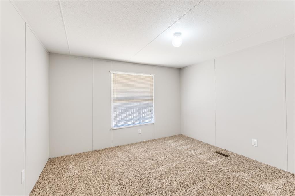 445 Arvel Circle Azle, TX 76020 - Photo 14 of 25 an empty room with a window