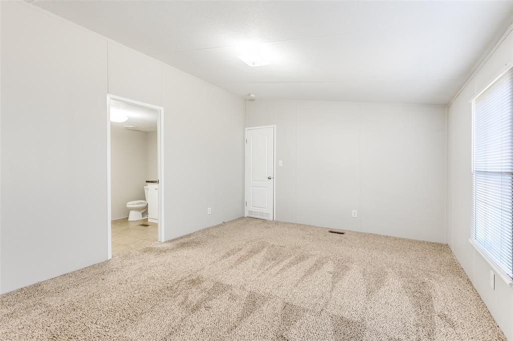 445 Arvel Circle Azle, TX 76020 - Photo 17 of 25 an empty room with a bathroom