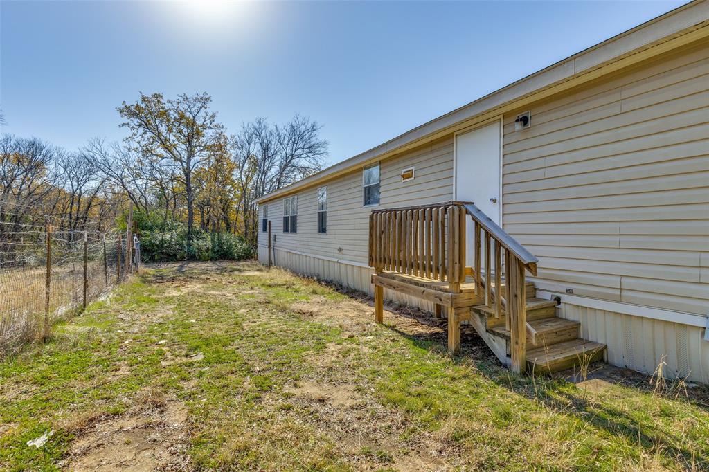 445 Arvel Circle Azle, TX 76020 - Photo 22 of 25 a view of a house with a yard