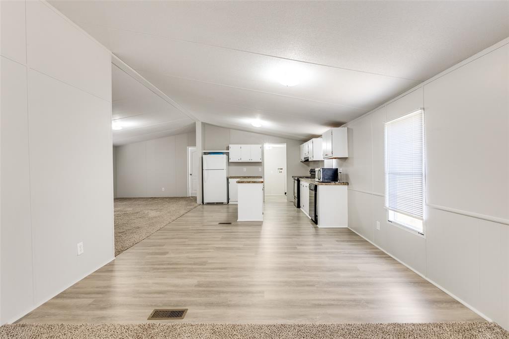 445 Arvel Circle Azle, TX 76020 - Photo 4 of 25 a view of kitchen with wooden floor