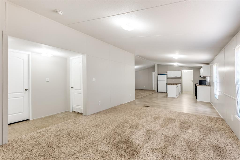 445 Arvel Circle Azle, TX 76020 - Photo 5 of 25 a view of empty room with a kitchen