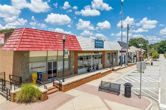 an aerial view of a house with a swimming pool outdoor seating and yard