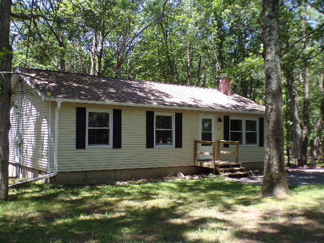101 Mohawk Trail Albrightsville, PA 18210 - Photo 2 of 16 a front view of a house with a yard
