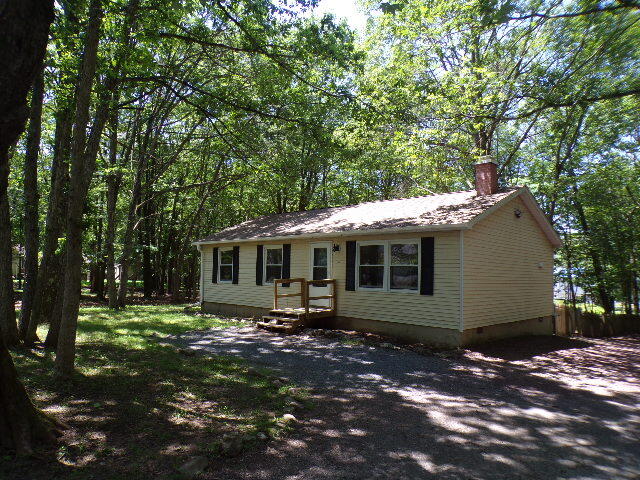 101 Mohawk Trail Albrightsville, PA 18210 - Photo 3 of 16 a front view of a house with a garden