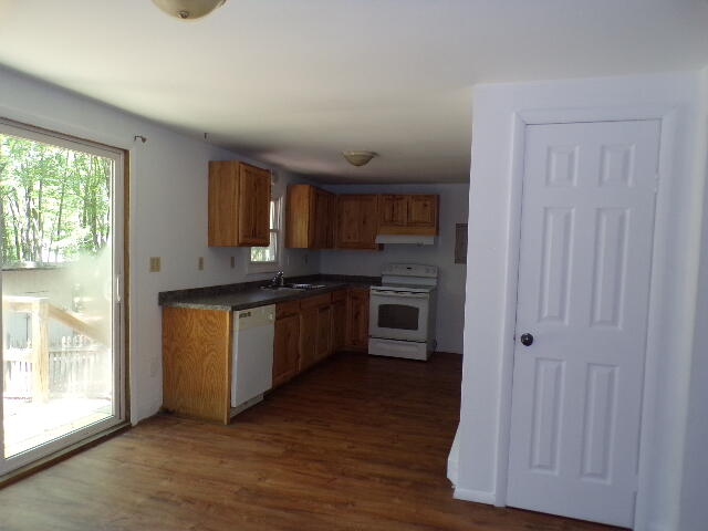 101 Mohawk Trail Albrightsville, PA 18210 - Photo 9 of 16 a kitchen with stainless steel appliances granite countertop a stove a sink and a refrigerator