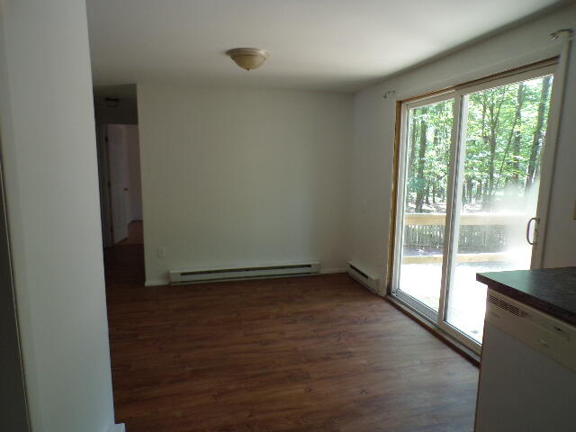 101 Mohawk Trail Albrightsville, PA 18210 - Photo 10 of 16 a view of an empty room with wooden floor and a window