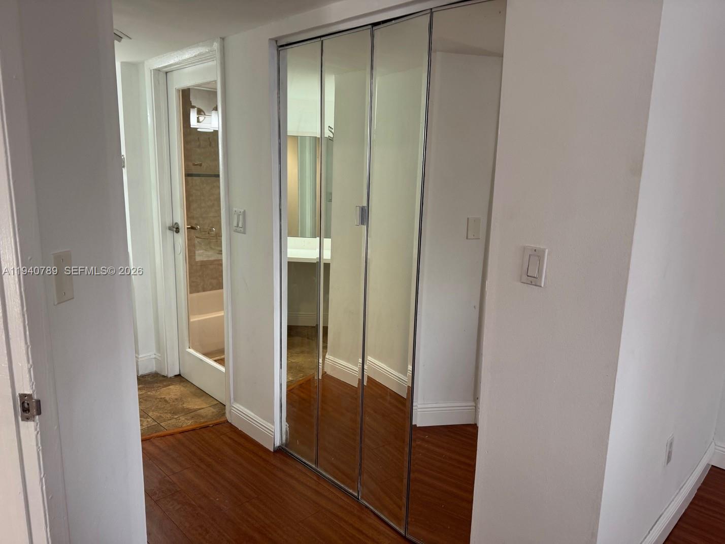 8335 Southwest 152nd Avenue, Unit B309 Miami, FL 33193 - Photo 19 of 26 a bathroom with a glass shower door