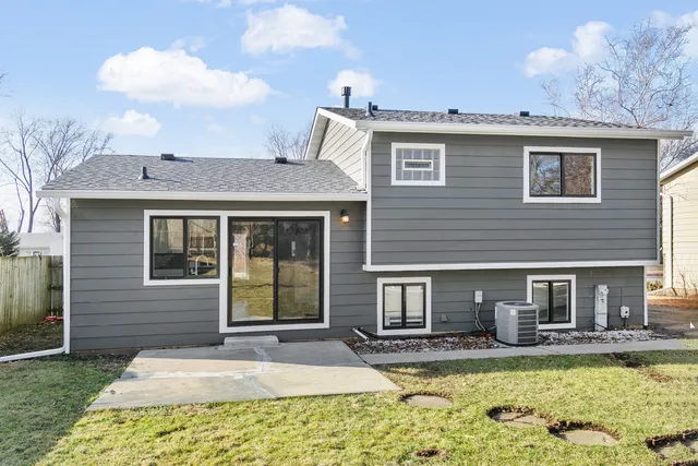 a view of a house with swimming pool and sitting area