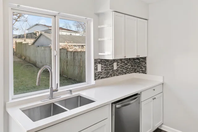 a view white cabinets and sink