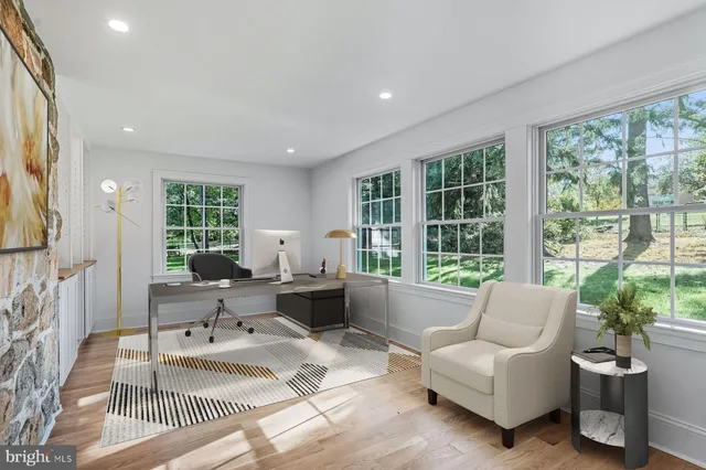 a view of an entryway with wooden floor