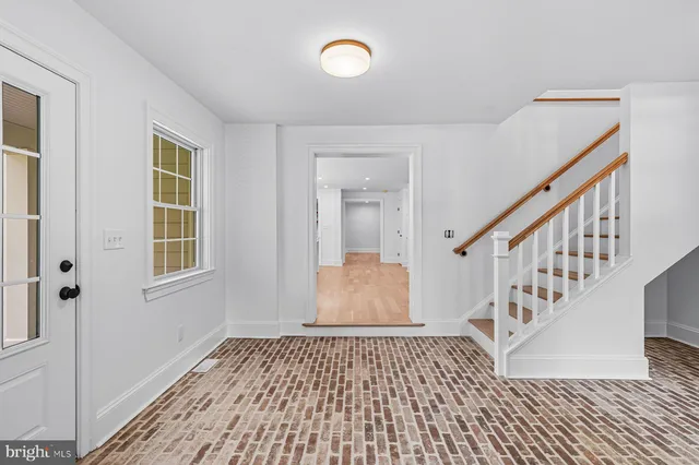 a bathroom with a tub sink shower and mirror