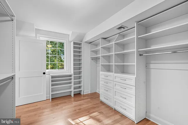 a spacious bathroom with a double vanity sink mirror and