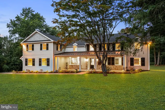 a large dining hall with stainless steel appliances granite countertop a stove top oven a sink dishwasher a dining table and chairs with wooden floor