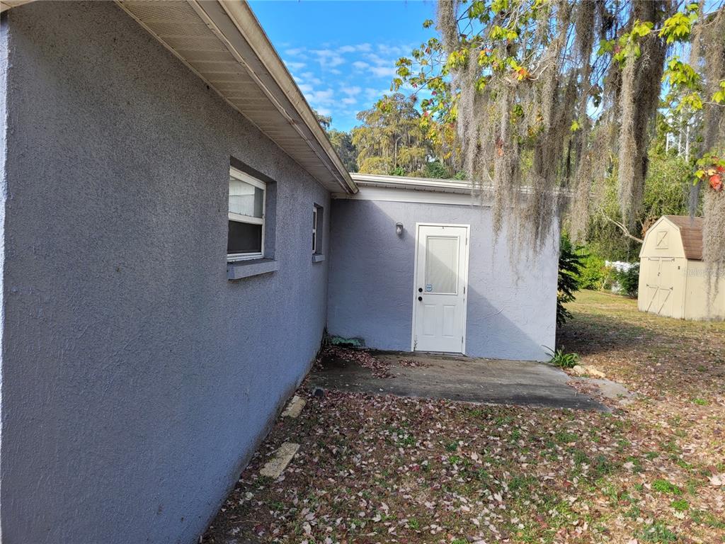 7809 Rusty Oak Drive New Port Richey, FL 34653 - Photo 20 of 24 Door Leading from Bonus Room to Patio Area