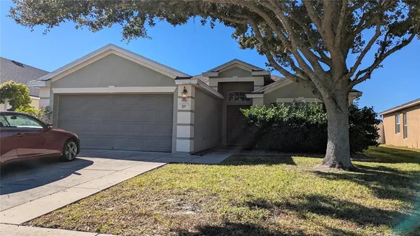 a front view of a house with a yard