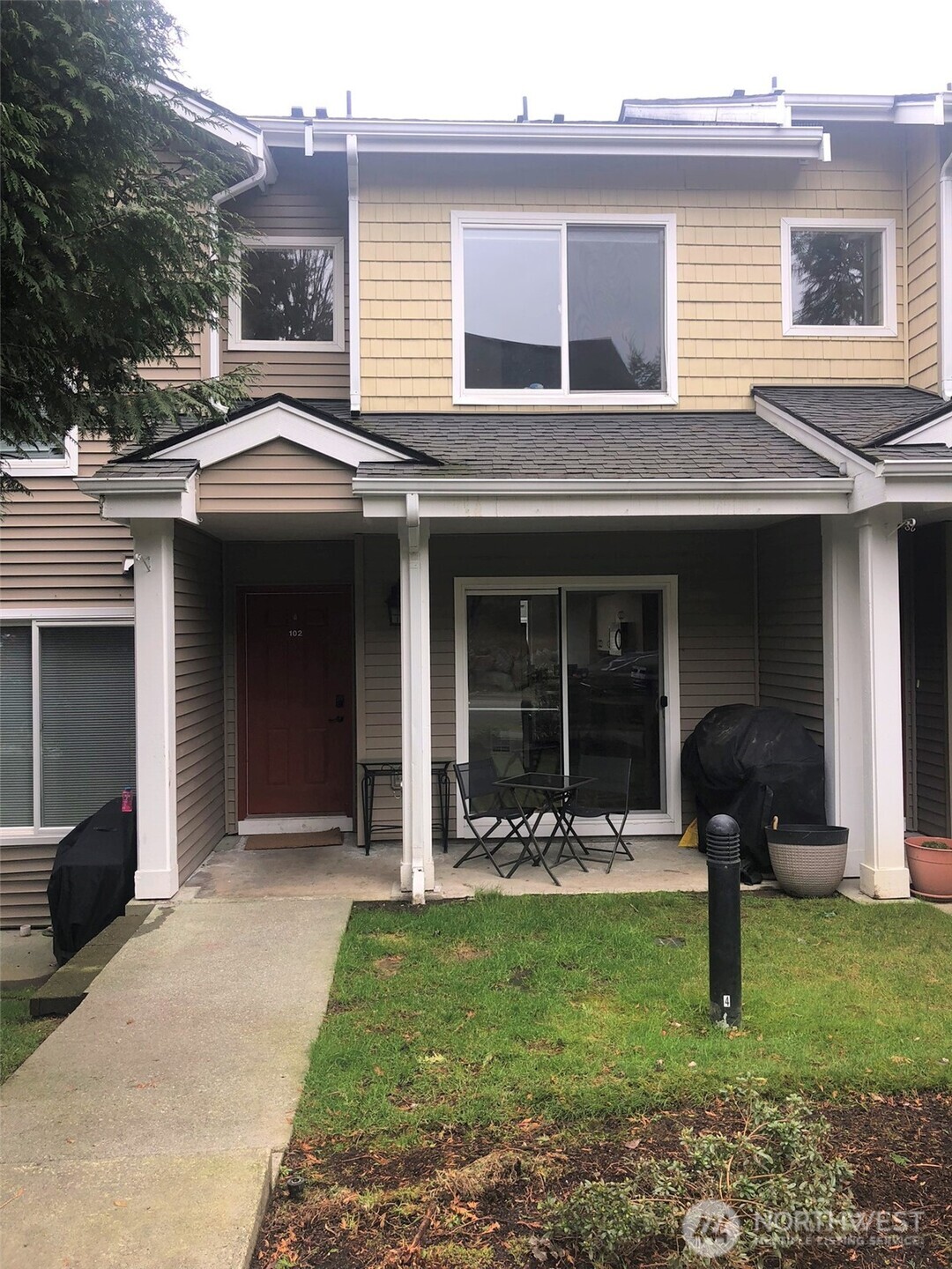 a front view of a house with a yard
