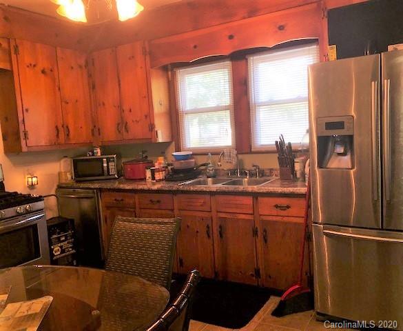 131 Marigold Street Rockingham, NC 28379 - Photo 7 of 8 a kitchen with stainless steel appliances a refrigerator a sink a stove and a refrigerator