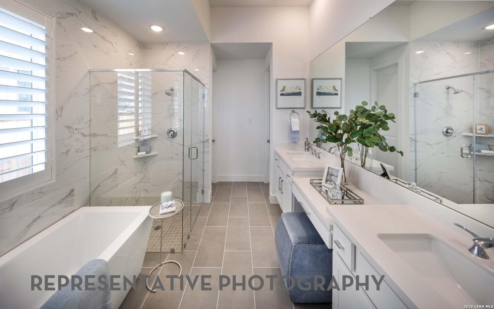 237 Boulder Creek Boerne, TX 78006 - Photo 15 of 32 a bathroom with a bathtub sink and toilet