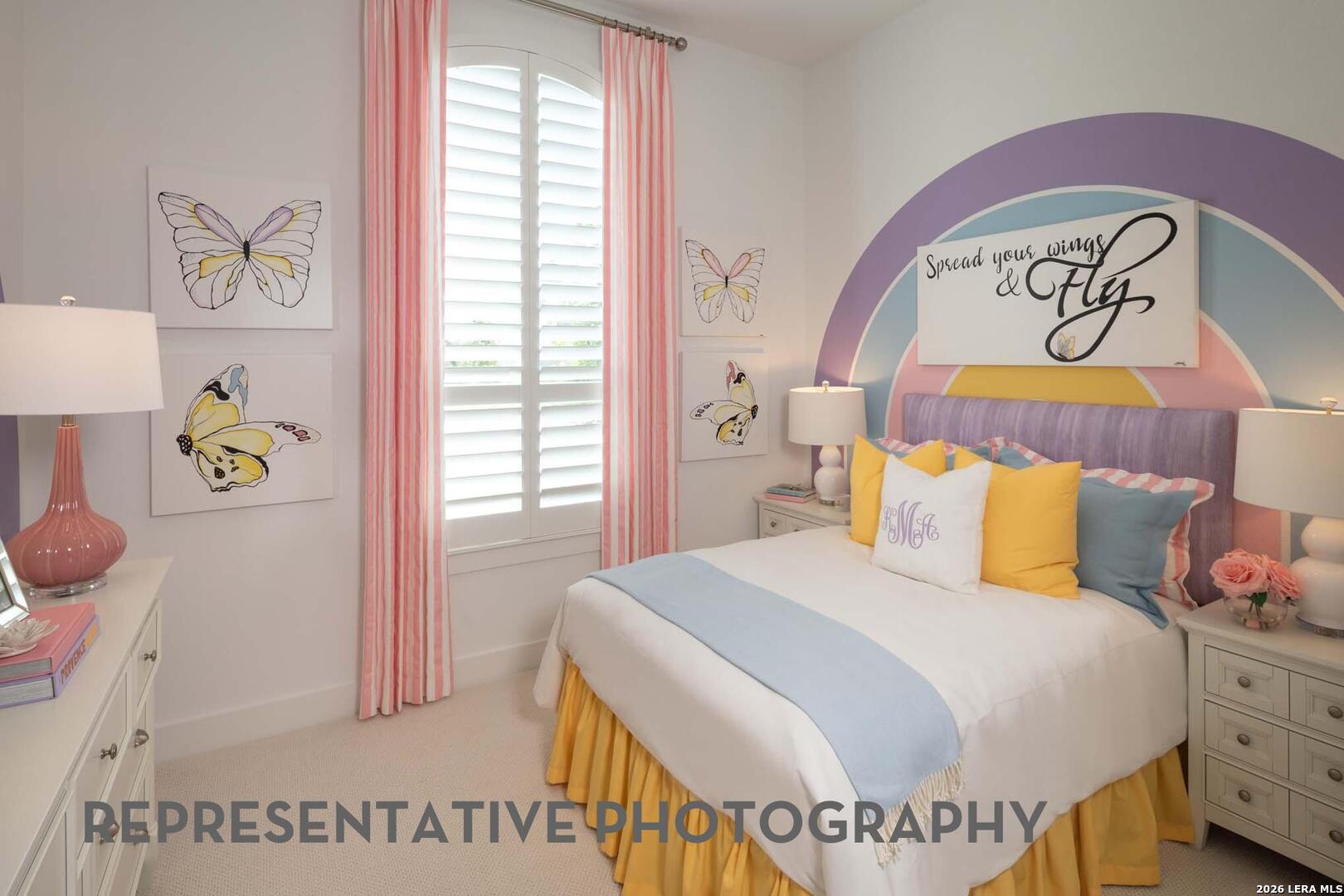 237 Boulder Creek Boerne, TX 78006 - Photo 22 of 32 a bedroom with a bed and a table in it