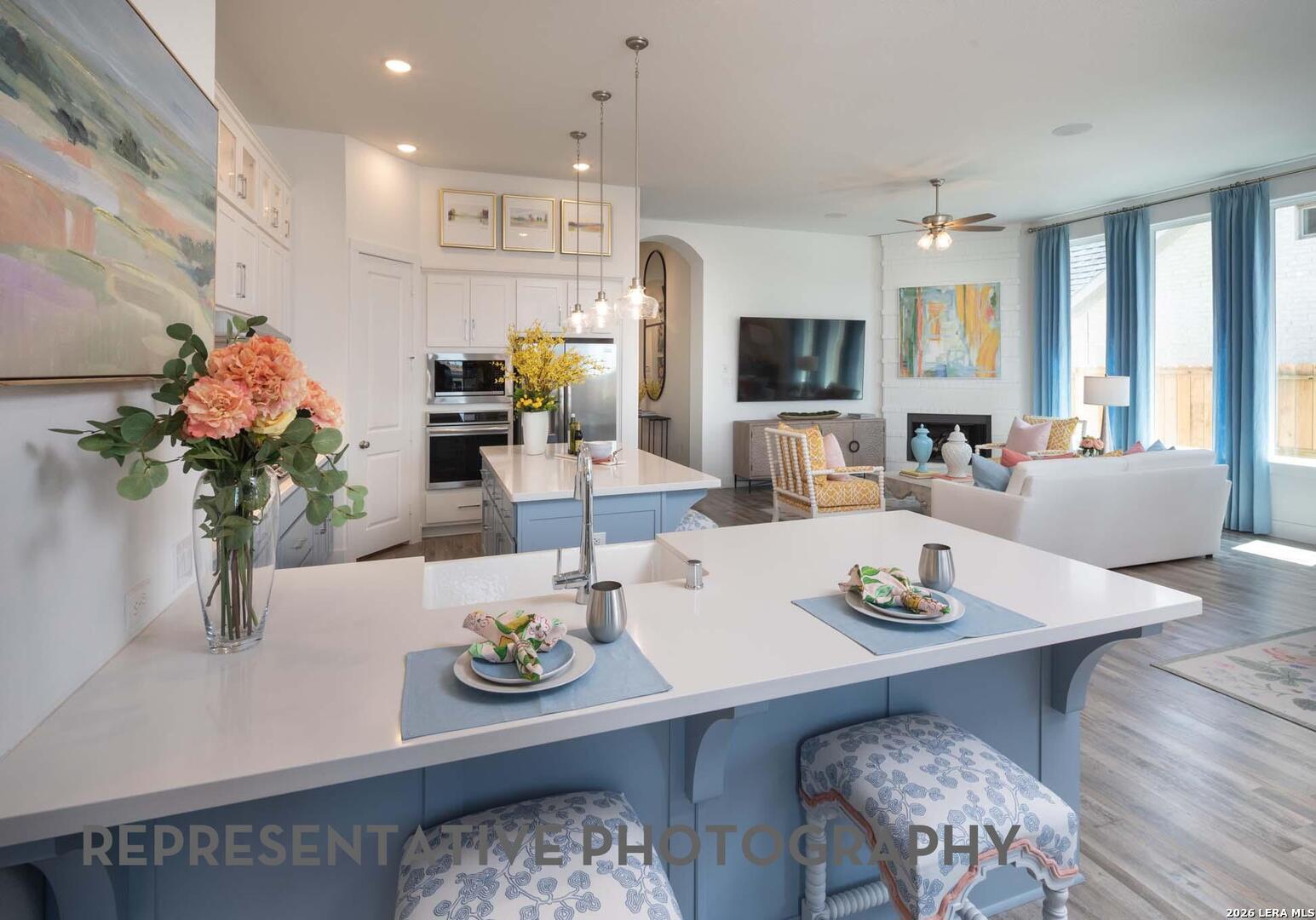 237 Boulder Creek Boerne, TX 78006 - Photo 4 of 32 a dining room with furniture kitchen view and large windows