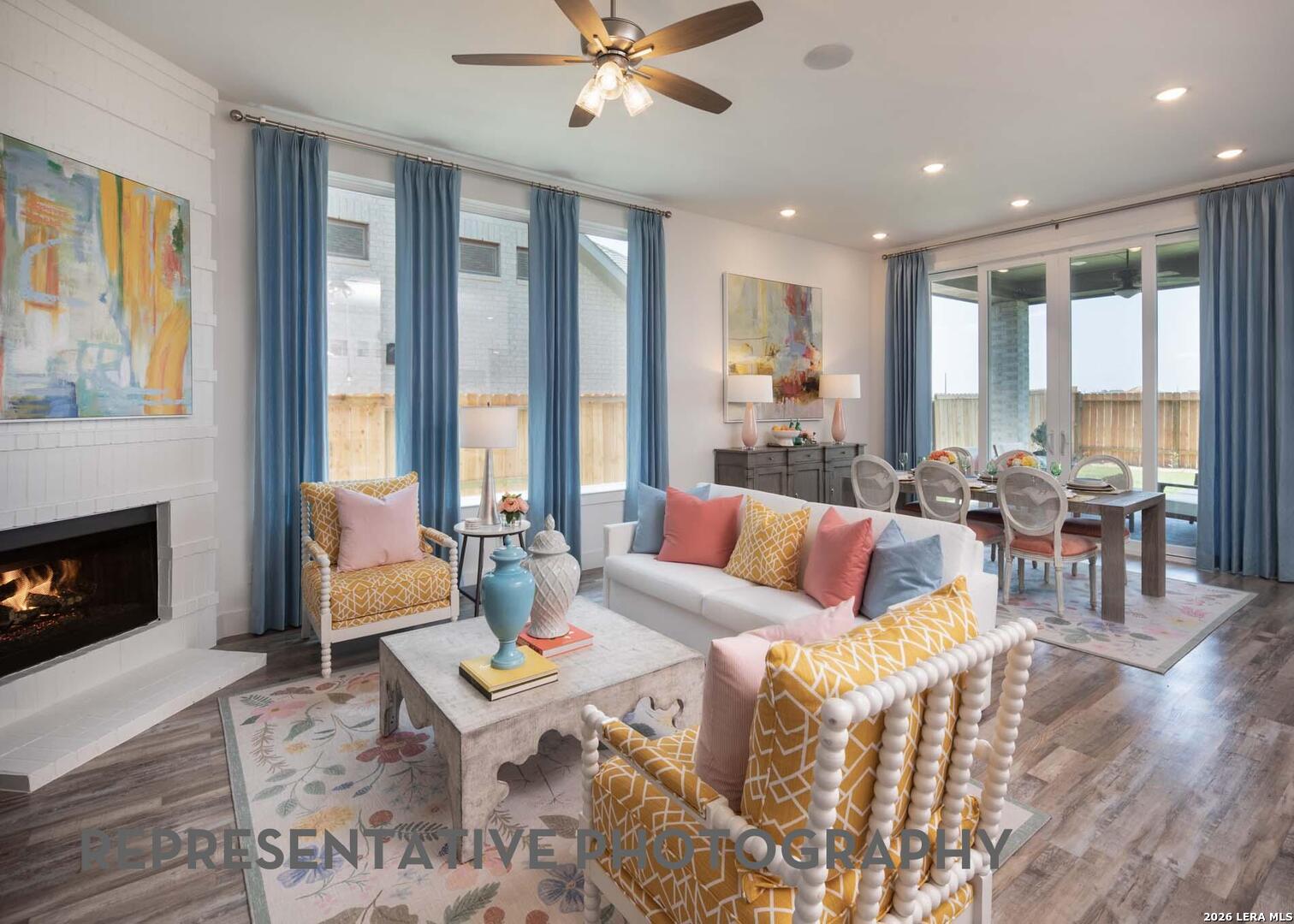 237 Boulder Creek Boerne, TX 78006 - Photo 9 of 32 a living room with furniture and a fireplace