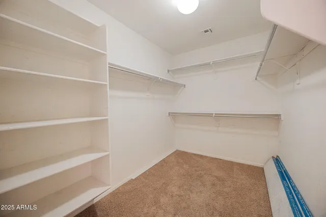 a view of an empty walk in closet