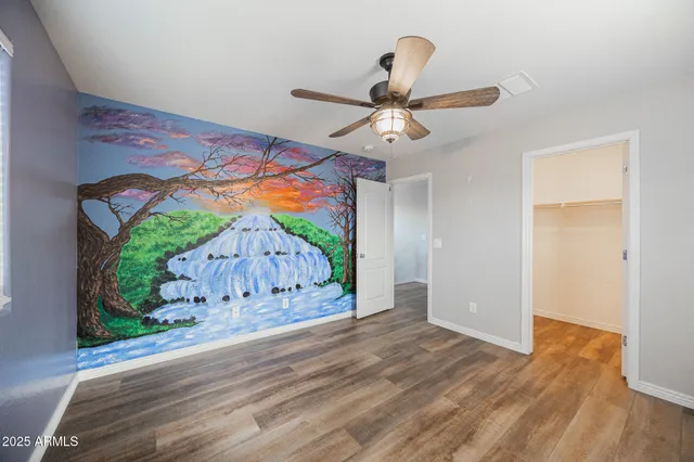 wooden floor in a hall with a window