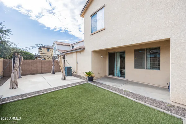 a view of a backyard with a sitting area