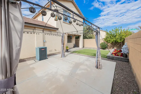 a view of a house with backyard and porch