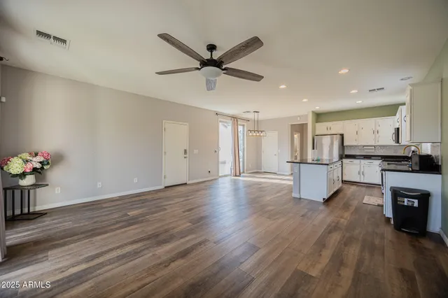 a view of kitchen with cabinets and wooden floor