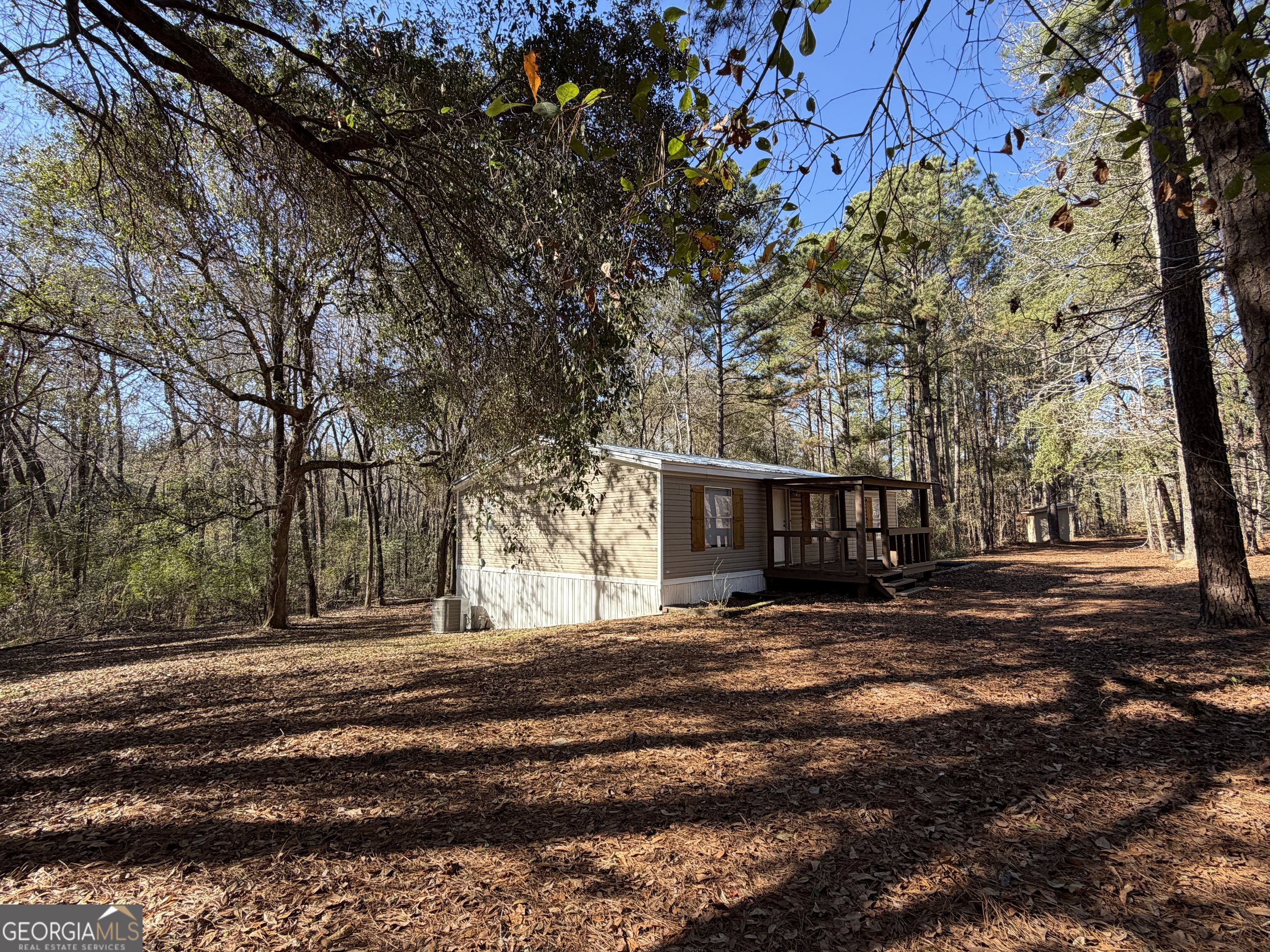 927 Louis Road Rentz, GA 31075 - Photo 4 of 22 a view of road with large trees