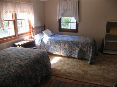46 Pilgrim Road Harwich Port, MA 02646 - Photo 15 of 17 a bed sitting in a bedroom next to a window