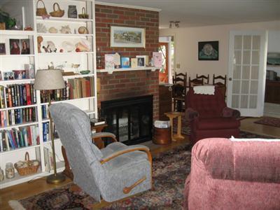 46 Pilgrim Road Harwich Port, MA 02646 - Photo 8 of 17 a living room with furniture and a fireplace