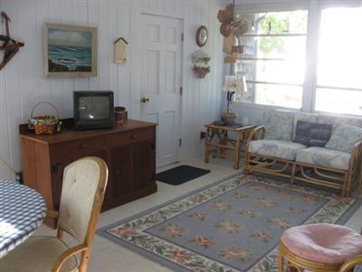 46 Pilgrim Road Harwich Port, MA 02646 - Photo 9 of 17 a living room with furniture and a fireplace