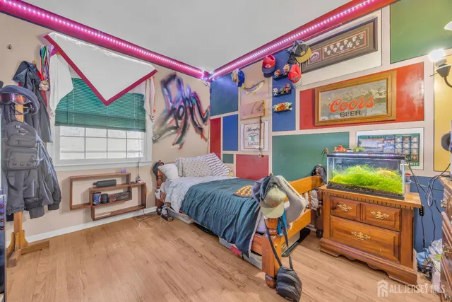 a bedroom with a bed and a tv