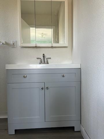 1225 Beacon Avenue San Mateo, CA 94401 - Photo 12 of 21 a bathroom with a sink and cabinets
