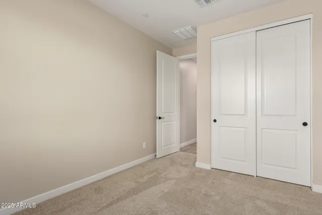 a bathroom with a granite countertop toilet a sink and a bathtub