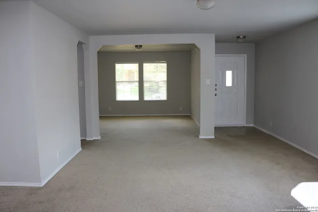 a view of a backyard with a lake view