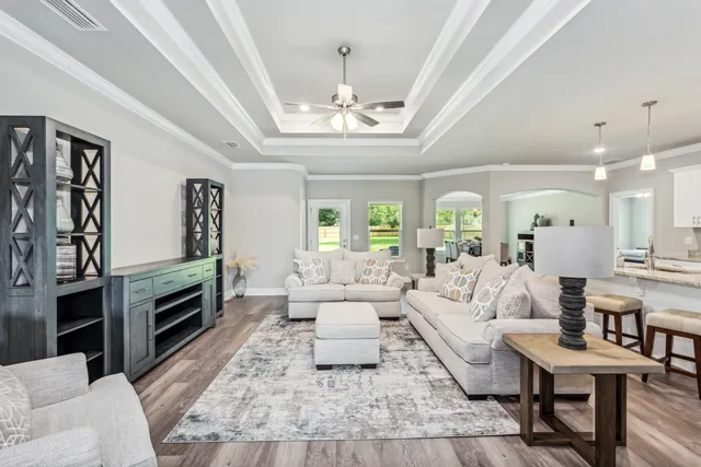 a living room with furniture fireplace and flat screen tv