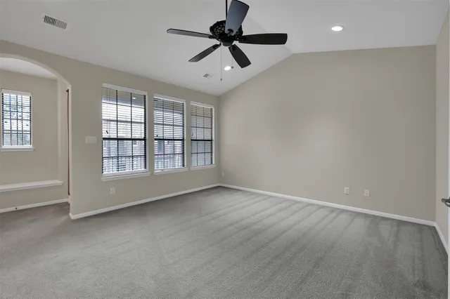 a bathroom with a bathtub and a window