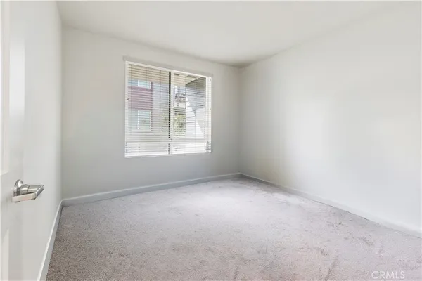 an empty room with wooden floor