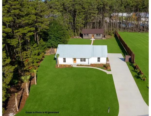 an aerial view of a house with a garden