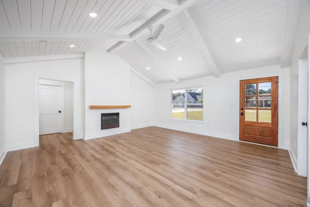a kitchen with stainless steel appliances granite countertop a sink and dishwasher with wooden floor