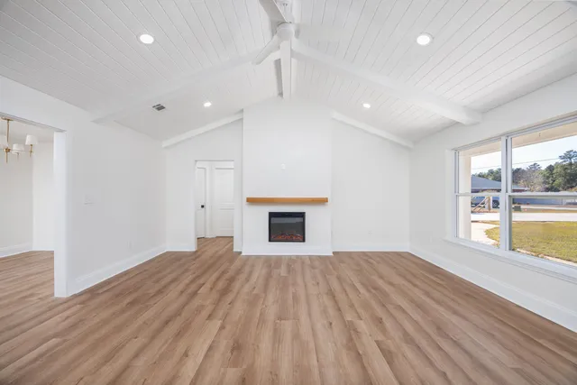 a kitchen with granite countertop a sink a counter space stainless steel appliances and cabinets