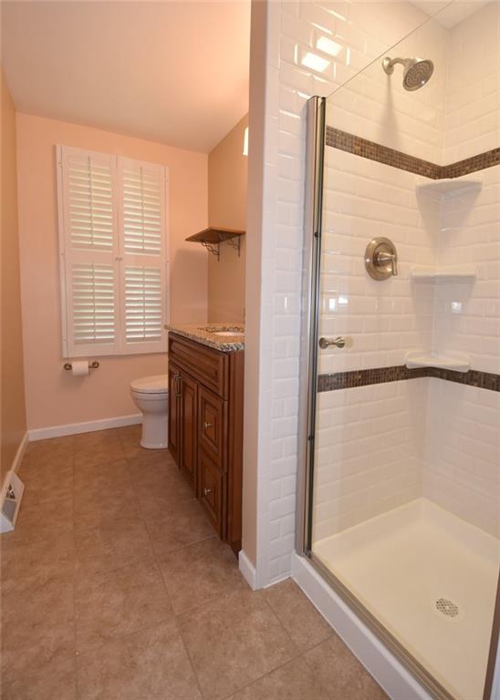 2356 Cramden Road Pittsburgh, PA 15241 - Photo 13 of 25 Completely updated is this beautiful Master bathroom...new flooring, new tiled shower and door, vanity, mirror, sink, faucet, ceramic tile flooring and paint. A custom design is waiting for your viewing.