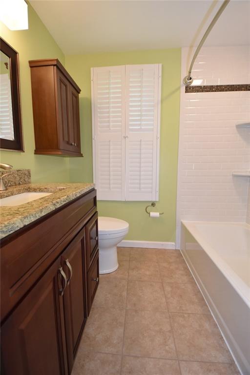 2356 Cramden Road Pittsburgh, PA 15241 - Photo 17 of 25 Custom full bath on the second floor...new ceramic tile flooring, new granite counter top, new tile shower surround, new toilet, new mirror, lighting and small cabinetry above the toilet.