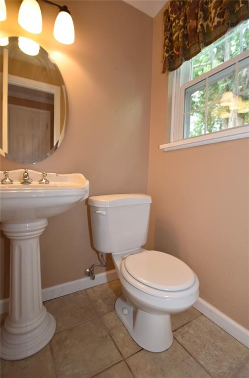 2356 Cramden Road Pittsburgh, PA 15241 - Photo 20 of 25 1/2 bath/ powder room adjacent to the family room. There is new flooring, new toilet, new sink, new faucets, mirror, lighting...a wonderful home!