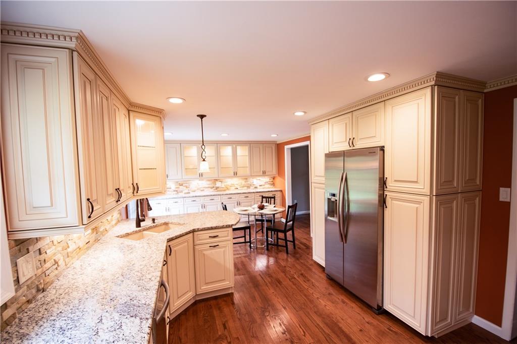 2356 Cramden Road Pittsburgh, PA 15241 - Photo 5 of 25 WOW...stunning and beautiful is this completely renovated and re-designed kitchen! Stacked stone back splash, new granite counter tops, new custom kitchen cabinetry that is the "soft touch" design!