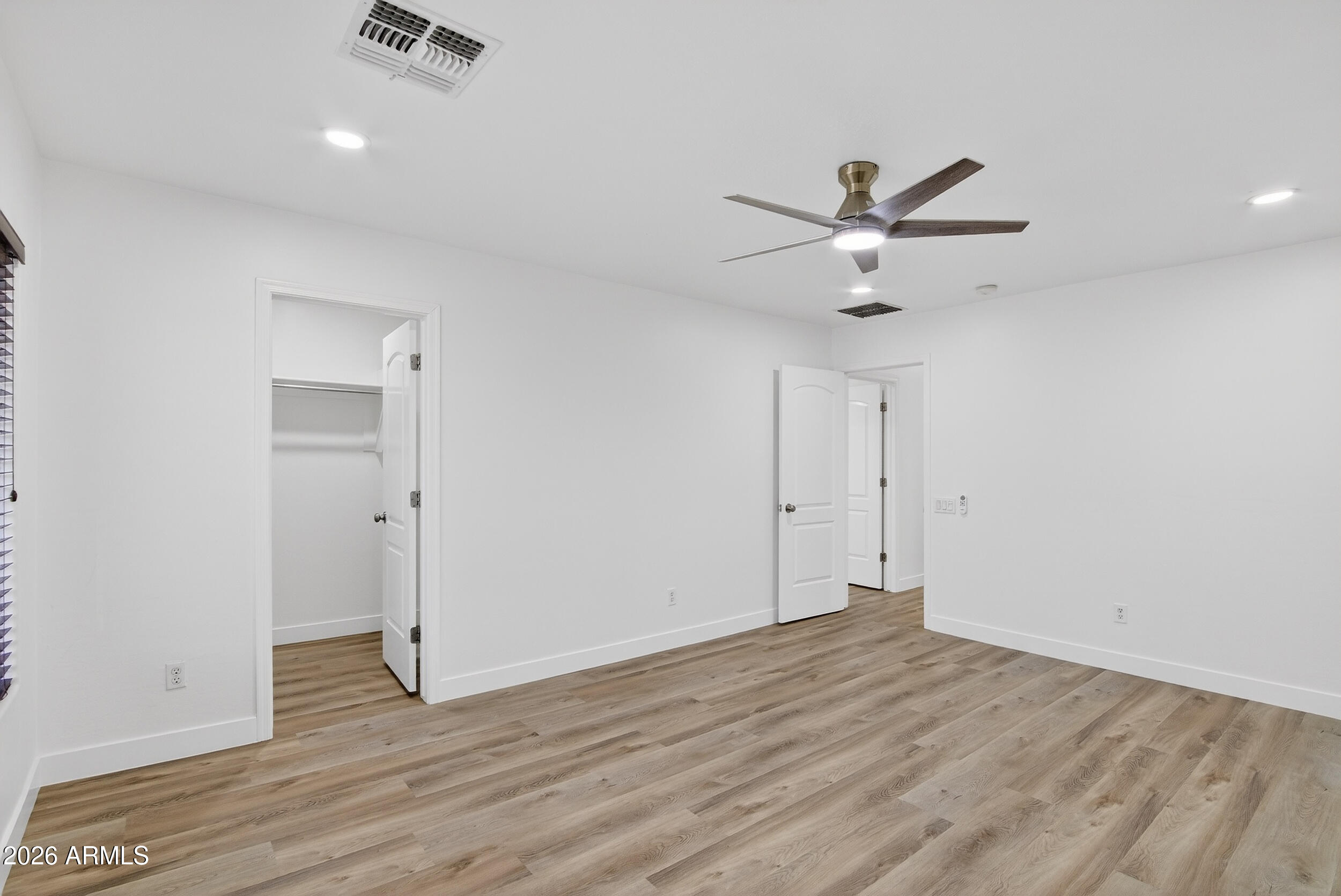 43620 West Cowpath Road Maricopa, AZ 85138 - Photo 40 of 60 wooden floor in an empty room